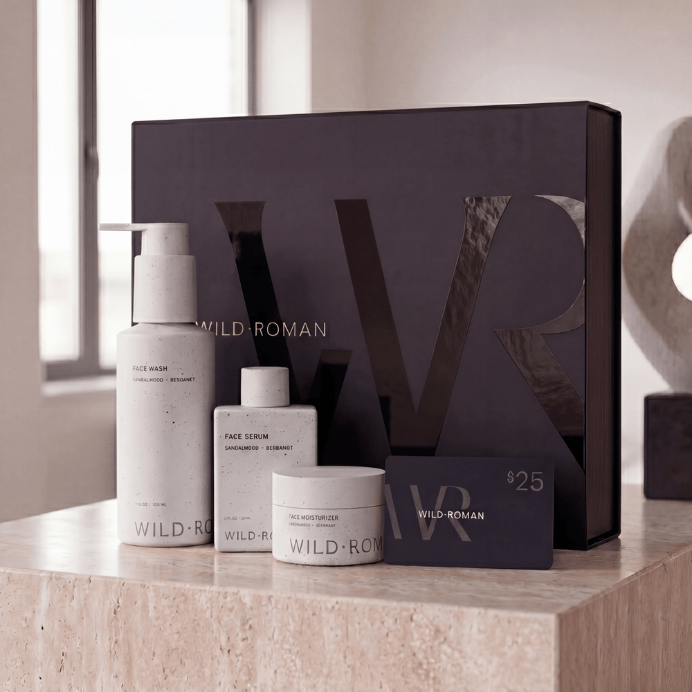 Wild Roman skincare products on a counter with a large branded box in the background.