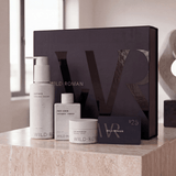 Wild Roman skincare products on a counter with a large branded box in the background.