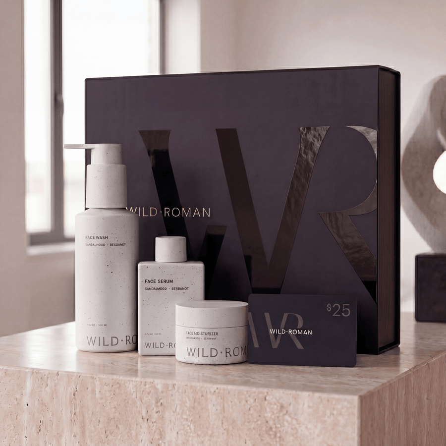 Wild Roman skincare products on a counter with a large branded box in the background.