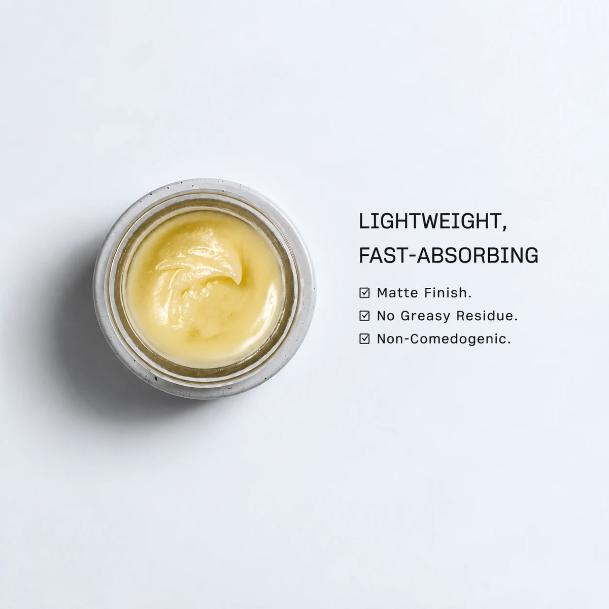 Open jar of WildRoman Face Moisturizer with a droplet on a light gray background, featuring text about product attributes.
