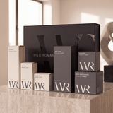 Collection of Wild Roman men's natural skincare products on a surface with a neutral background